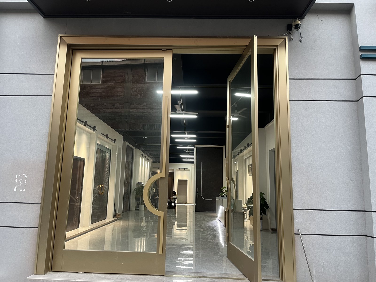 Showroom wide shot showing several door panels mounted on the wall